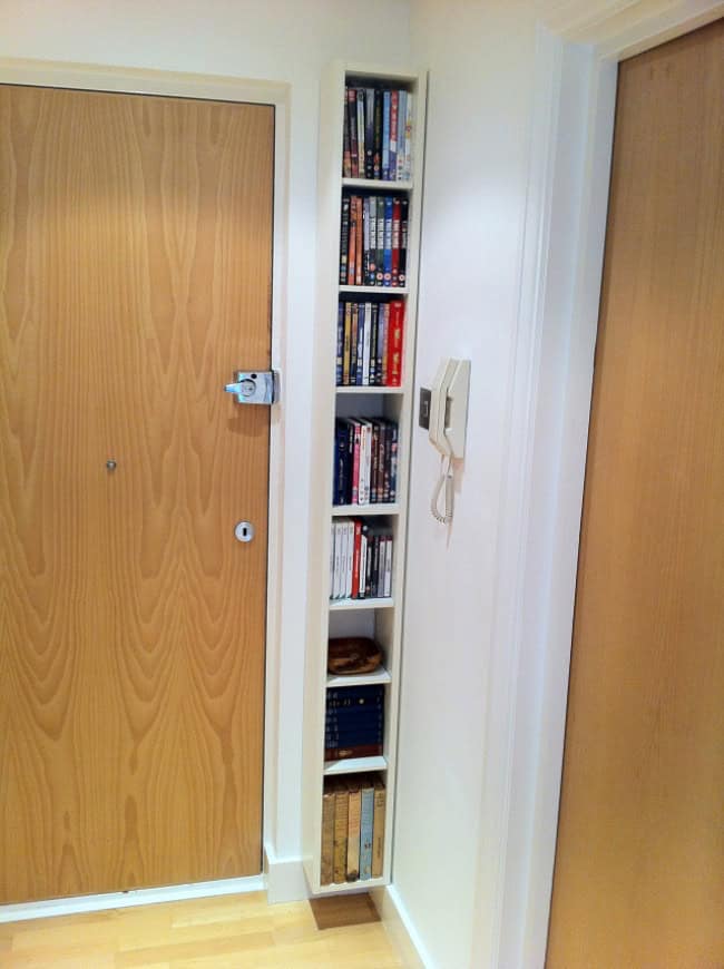 Put a thin bookcase in an empty corner Source