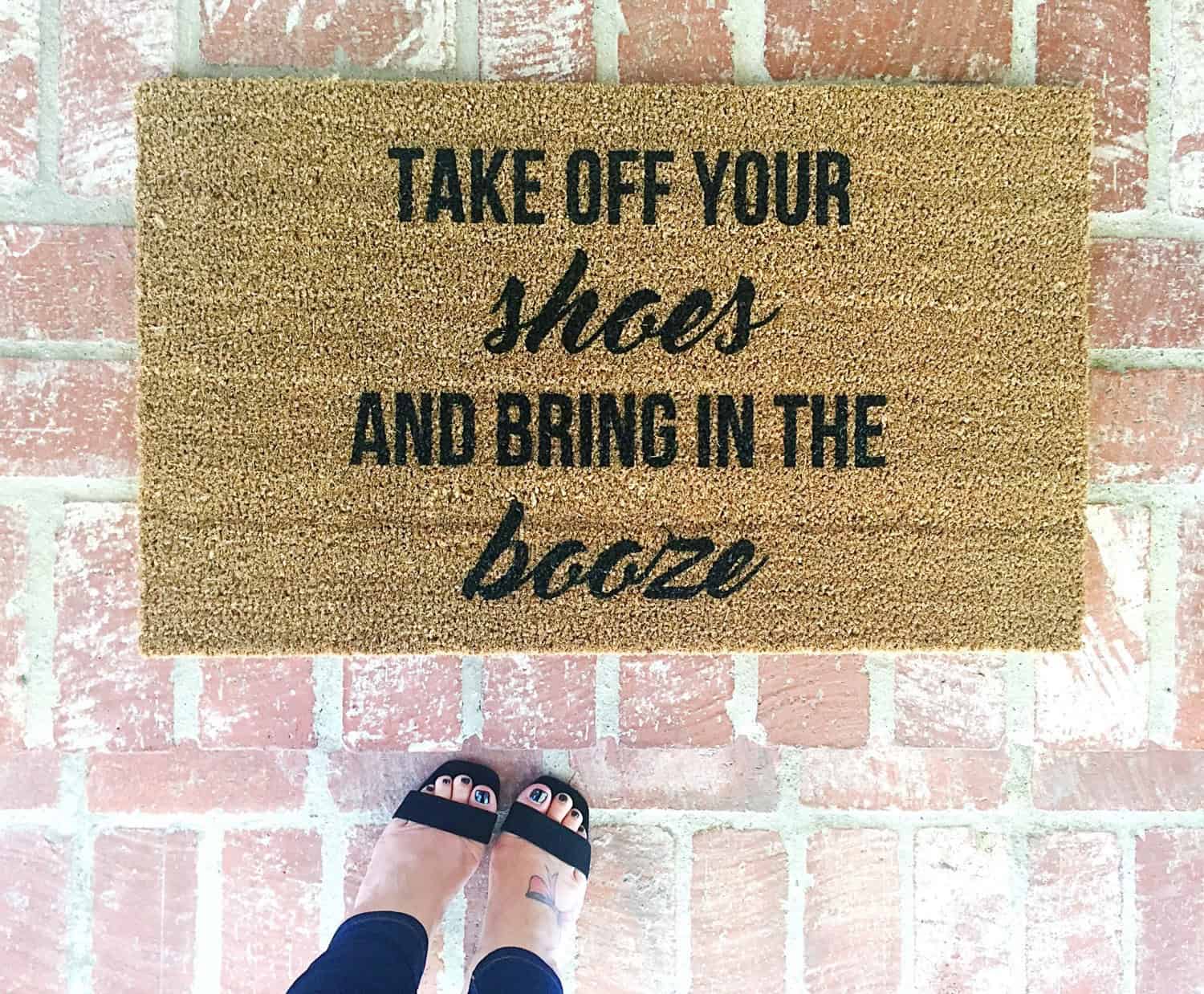 “Take off your shoes and bring in the booze” Door mat Buy it on: www.etsy.com