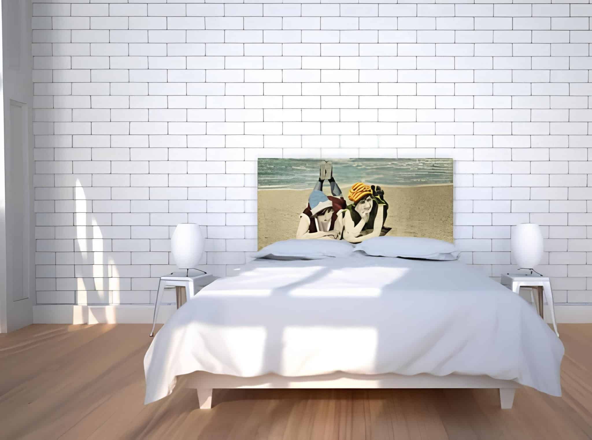 Minimalist white bedroom featuring a custom printed photo headboard with beach imagery.