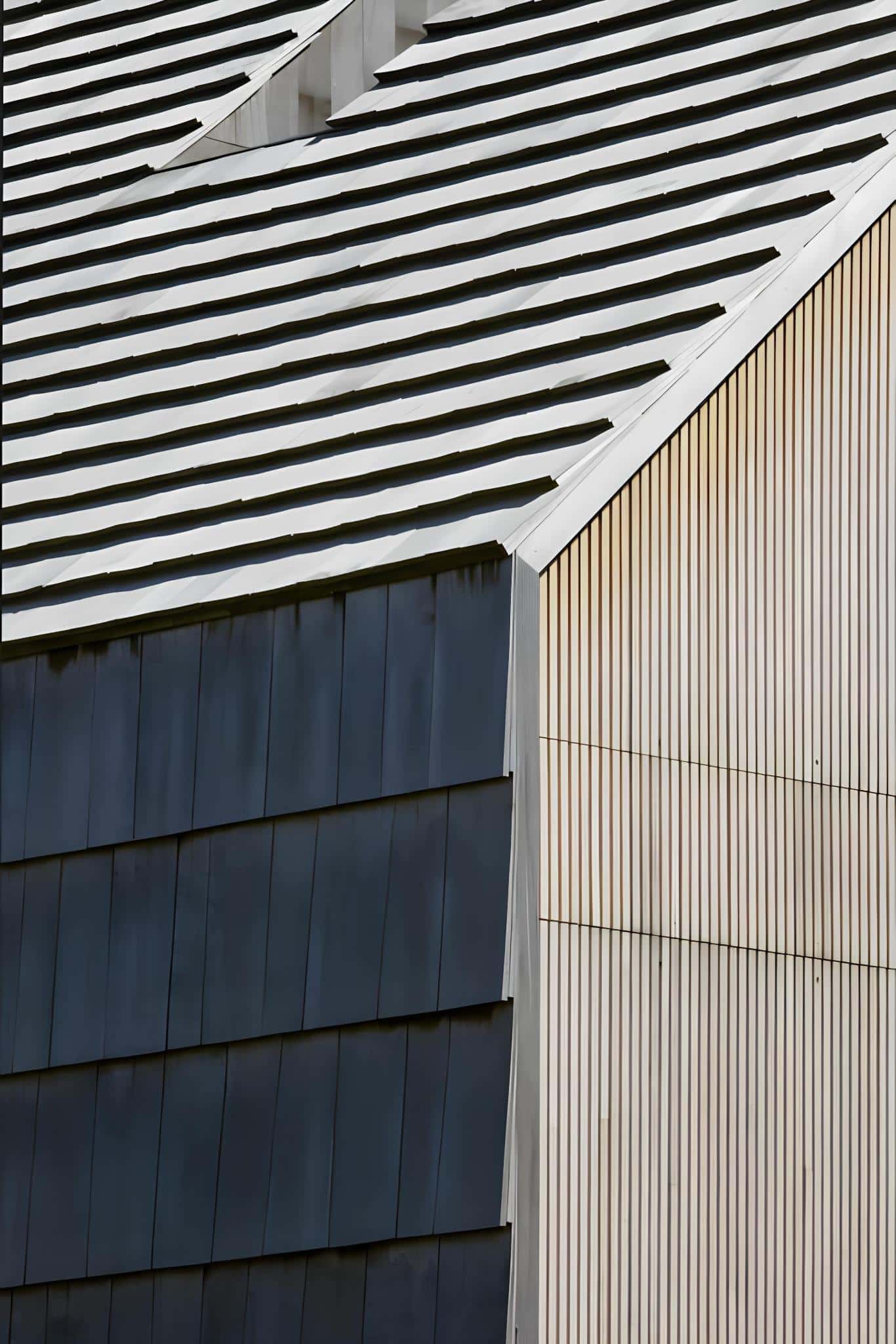 Floating Staircase with Vertical Slats Modern staircase with floating treads and vertical black slats.
