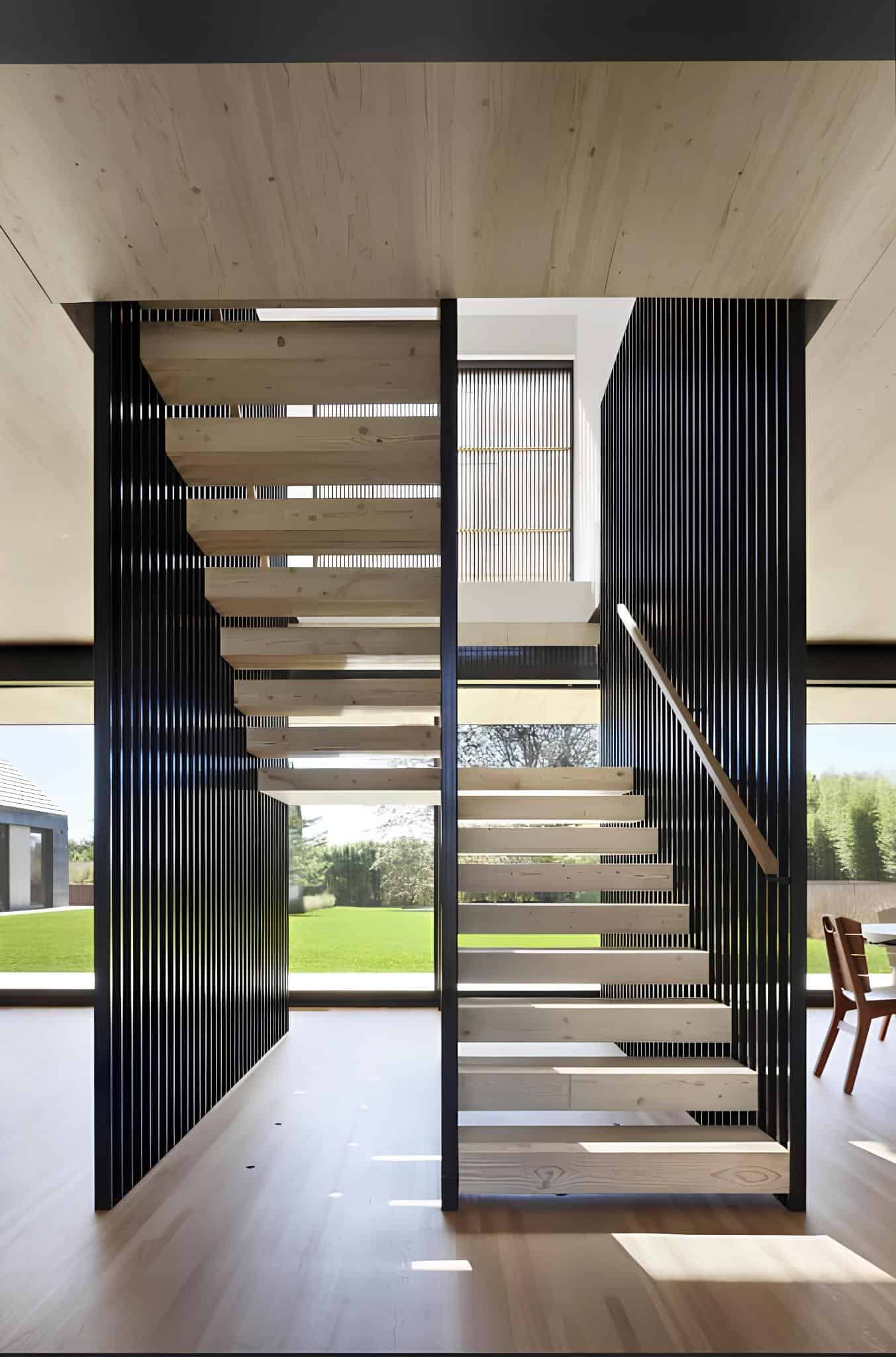Wood Kitchen Island and Open Plan Long wood island and sleek cabinetry in an open kitchen layout.