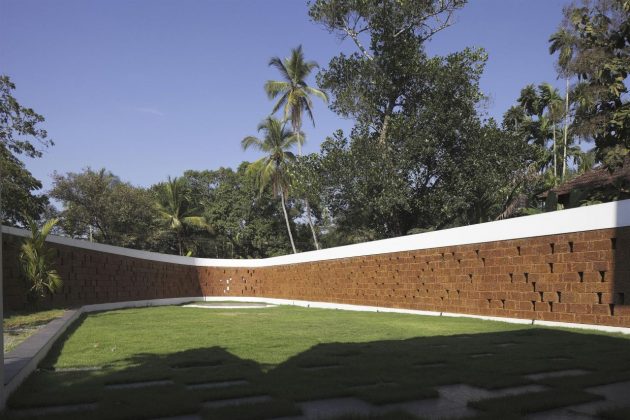 The Running Wall Residence by LIJO RENY Architects in Thalassery, India