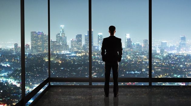 businessman standing in night office