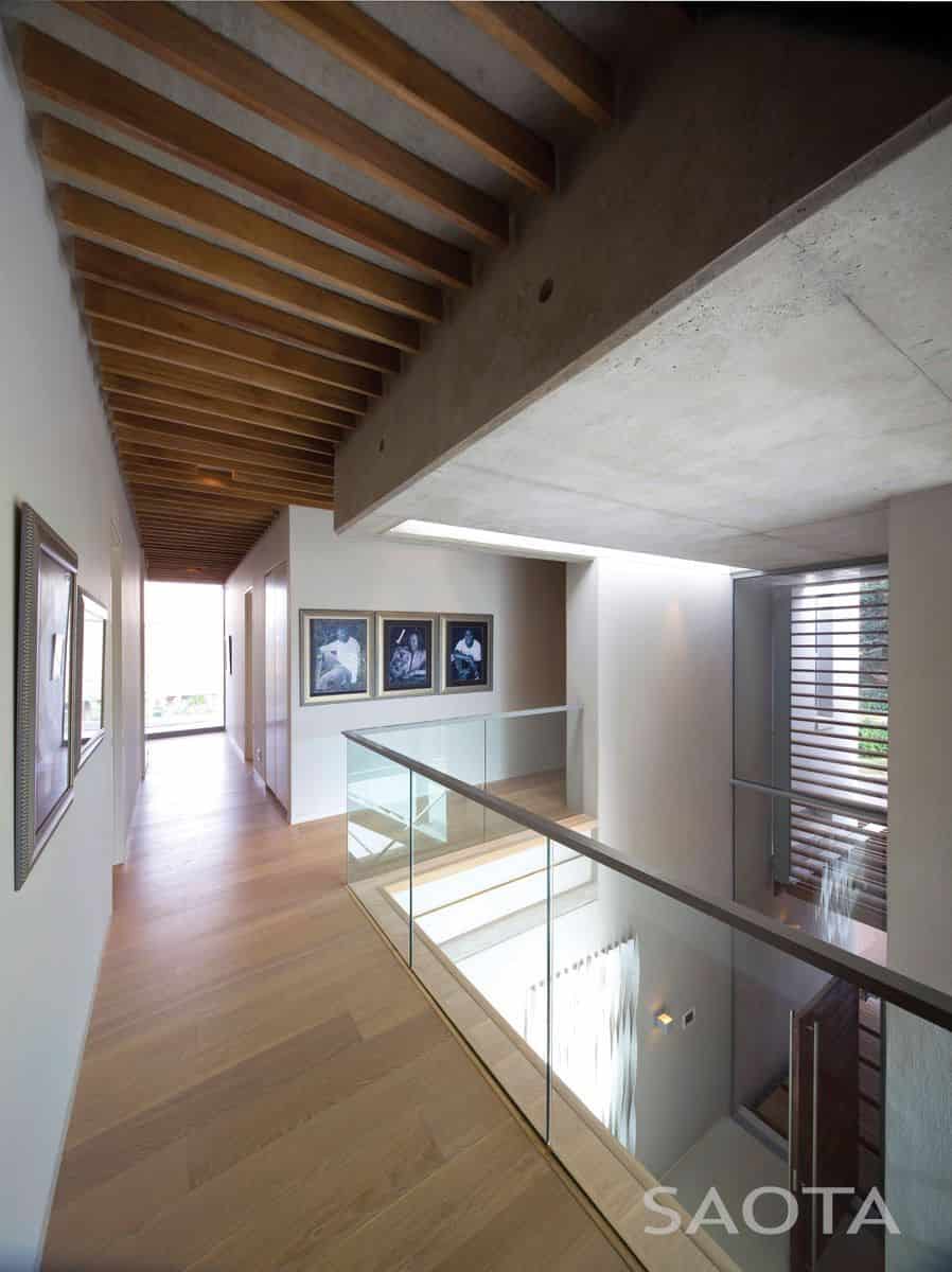 La Lucia — Screened upper level Upper-level façade with operable patterned screens shaping light and outlook over the ocean.