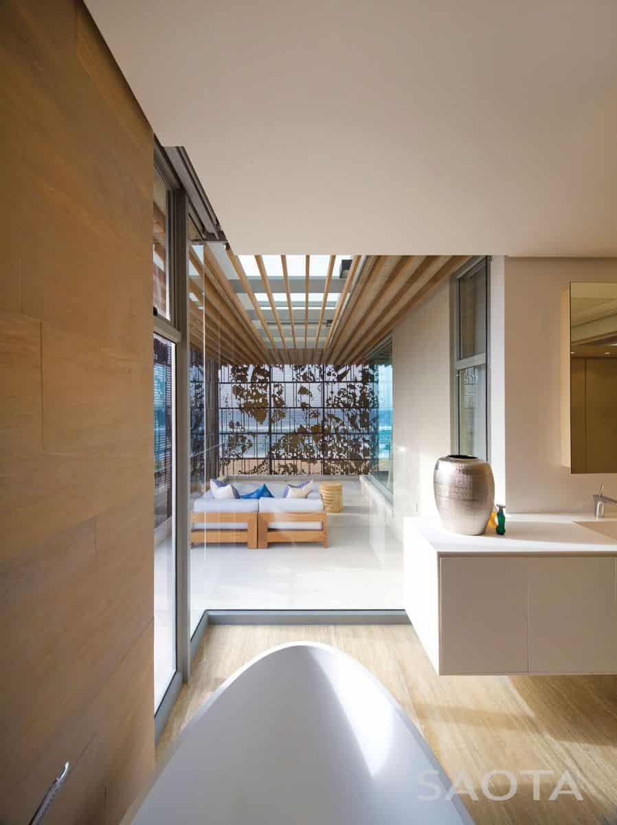 La Lucia — Sheltered deck living Sheltered deck with operable screens providing climate control and privacy at La Lucia house.