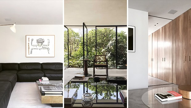 Sleek modern interior with minimalist black leather sofa, contemporary artwork, and clean white walls, showcasing stylish home decor design.