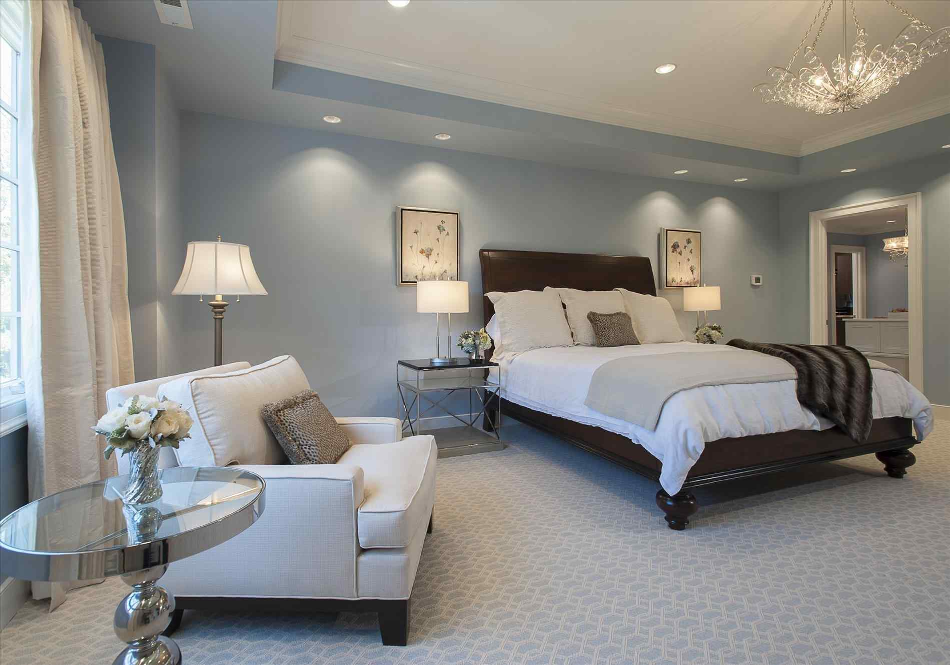 blue master bedroom with white furniture