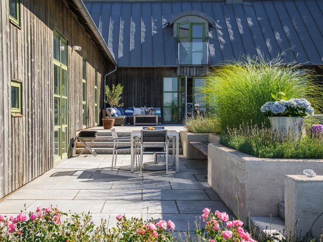 16 Beautiful Scandinavian Patio Designs That Fit Any Outdoor Space - Scandinavian Patio Design With Greenery And White