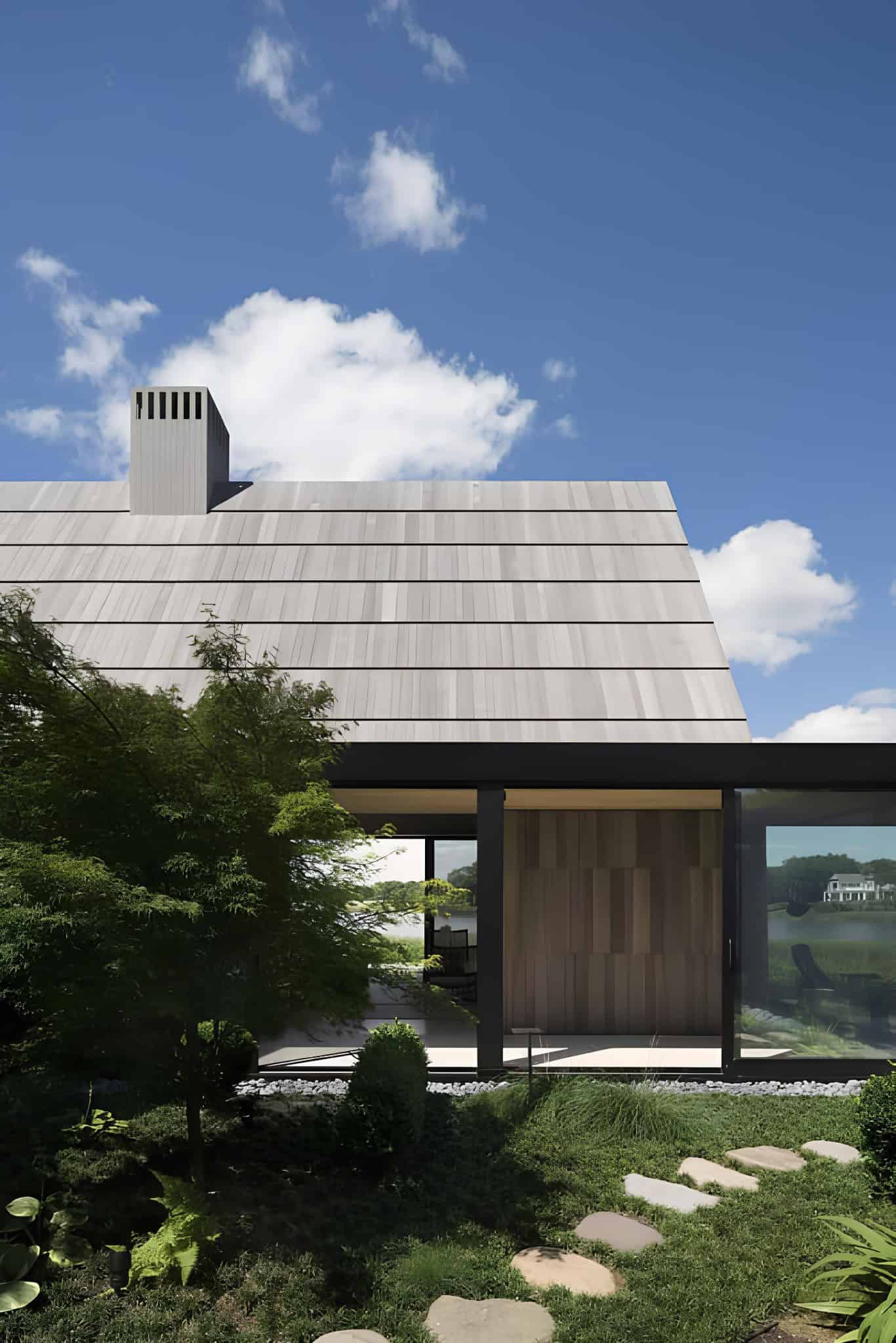 Angled Gable Structures and Grass Planter Angled gabled structures and lush green grass planter beds.