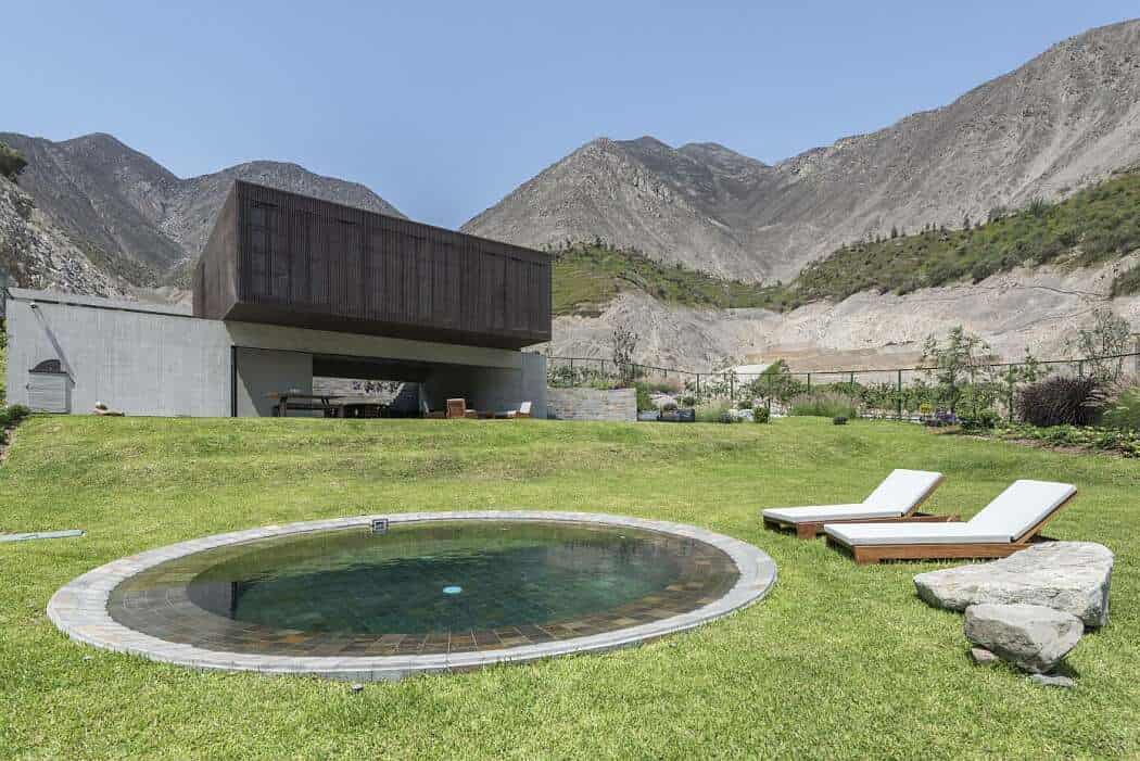 Modern mountain retreat with minimalist architecture, outdoor swimming pool, and scenic mountain views, perfect for nature lovers and design enthusiasts.