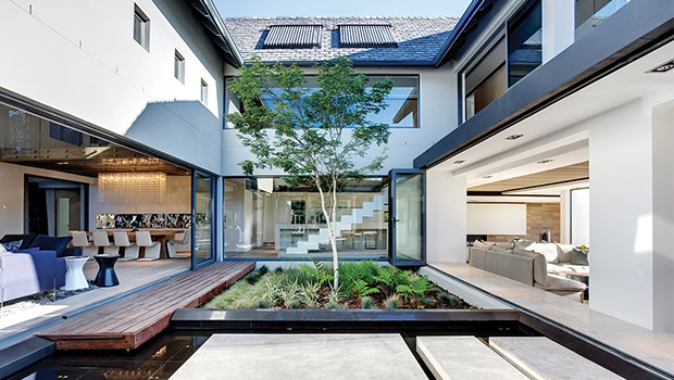 Modern luxury residential architecture with open living spaces, minimalist design, and seamless indoor-outdoor integration.