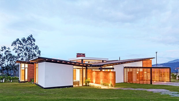 Modern contemporary house with sleek design and expansive glass doors, showcasing innovative architecture art designs and sustainable building materials.