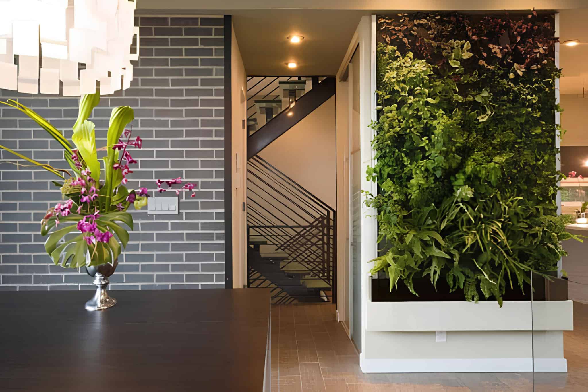 Modern patio setup with lounge chairs and vertical planters on wood wall