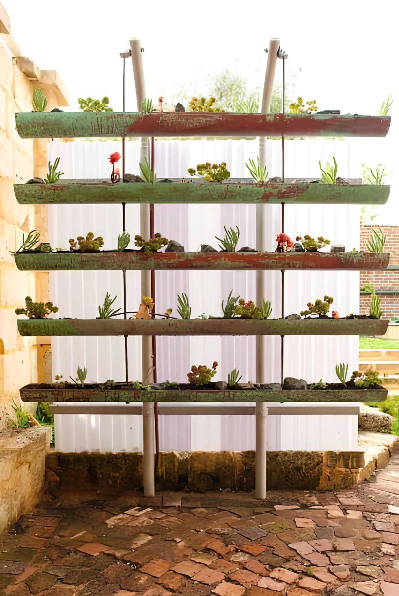 Rustic vertical planter with weathered wooden troughs and succulents