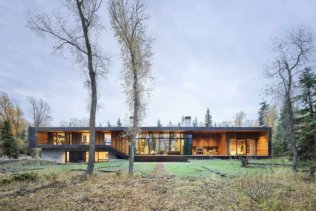 Modern minimalist wooden house with large glass windows in a forest setting, contemporary architecture design, sustainable and eco-friendly home, innovative residential building, Architecture Art Designs.