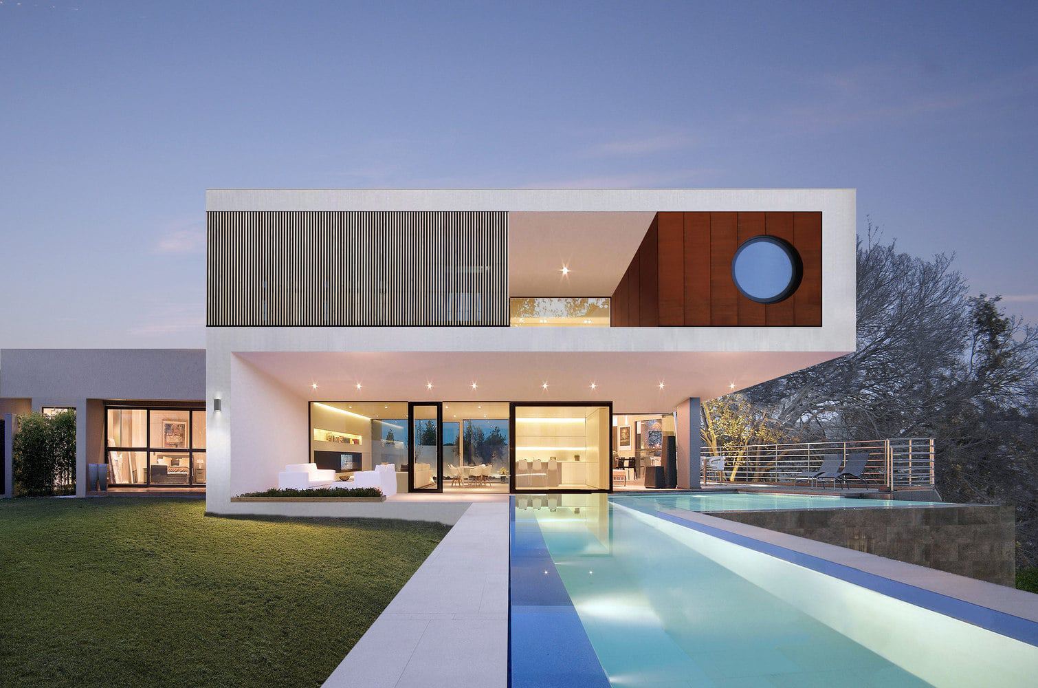 Contemporary modern house with sleek design, open plan living space, infinity pool, large glass windows, and minimalist architecture for luxury residential living.