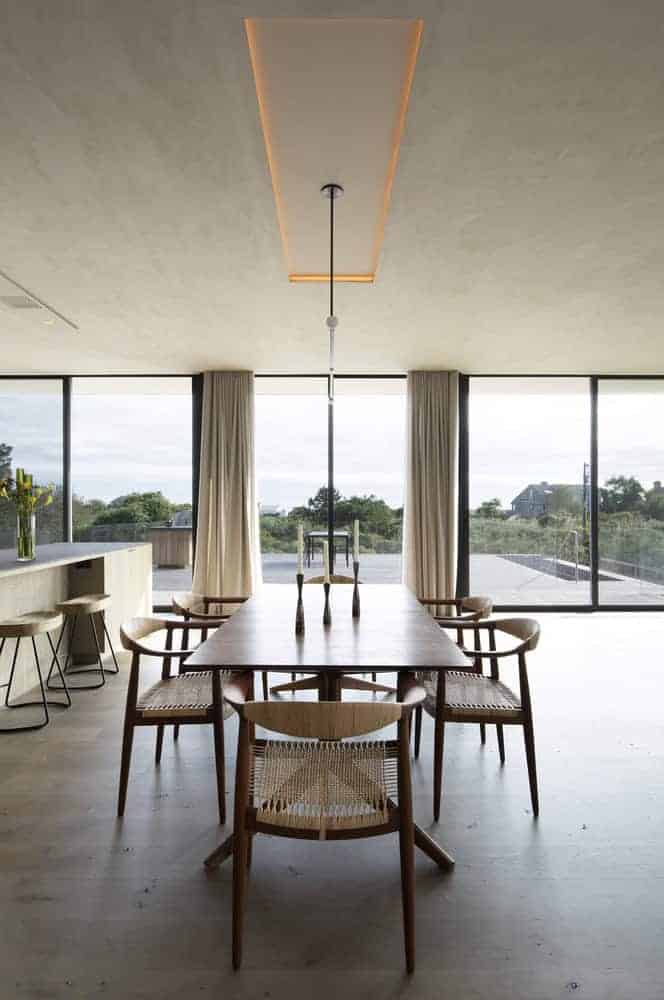 Kiht’han House Dining Area Modern Lighting Dining area of Kiht’han House with modern pendant lighting and large glazing.