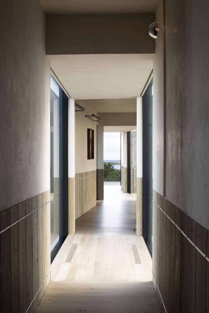 Kiht’han House Hallway Framing Ocean Views Long hallway in Kiht’han House framed with wood and open views to the ocean.