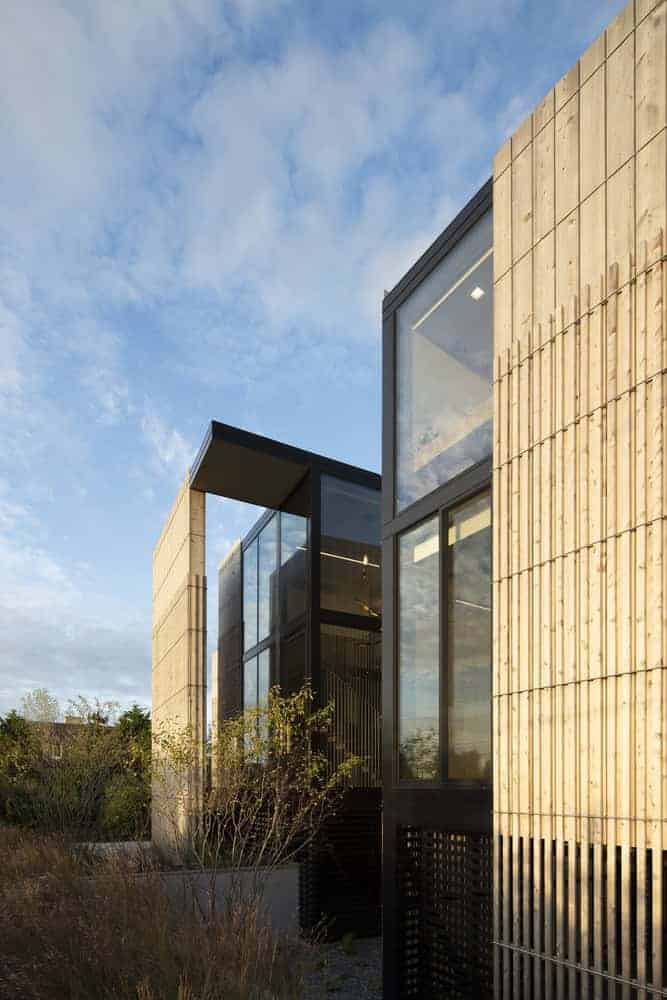 Kiht’han House Modern Wood Glass Detail Modern architecture detail of Kiht’han House with vertical wood siding and glass.
