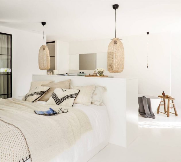 An En-Suite Bedroom with a Large White Bathroom
