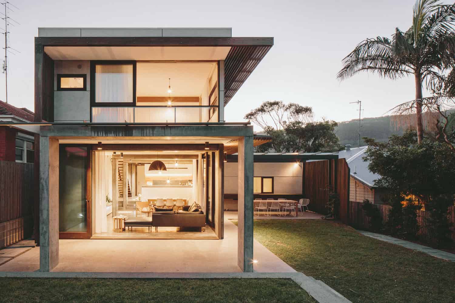 Contemporary modern house with open-plan living area, large glass windows, minimalist design, and outdoor patio showcasing innovative architecture and stylish interior decor.