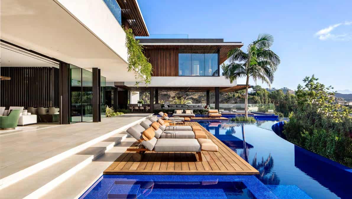 Modern luxury residential architecture with infinity pool, tropical landscaping, and contemporary design elements, perfect for upscale outdoor living and relaxation.