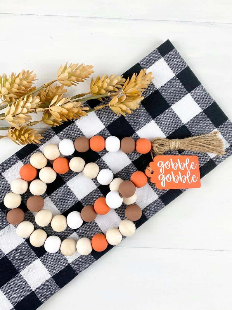 7. Orange, Brown, White, and Natural Wood Bead Garland with Wooden Tag 7. Orange, Brown, White, and Natural Wood Bead Garland with Wooden Tag