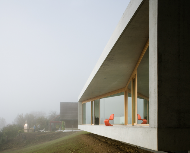Gauthier House by Bauzeit Architekten in Evilard, Switzerland