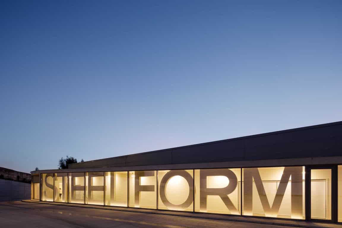 SHIELD Architecture Art Designs modern building with illuminated signage spelling "SHIELD" showcasing innovative architectural design.