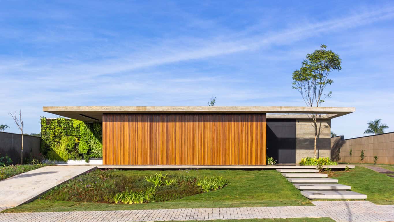 Modern minimalist house with wooden facade and landscaped garden, featuring clean lines and contemporary architecture design, ideal for modern outdoor living and stylish home exteriors.
