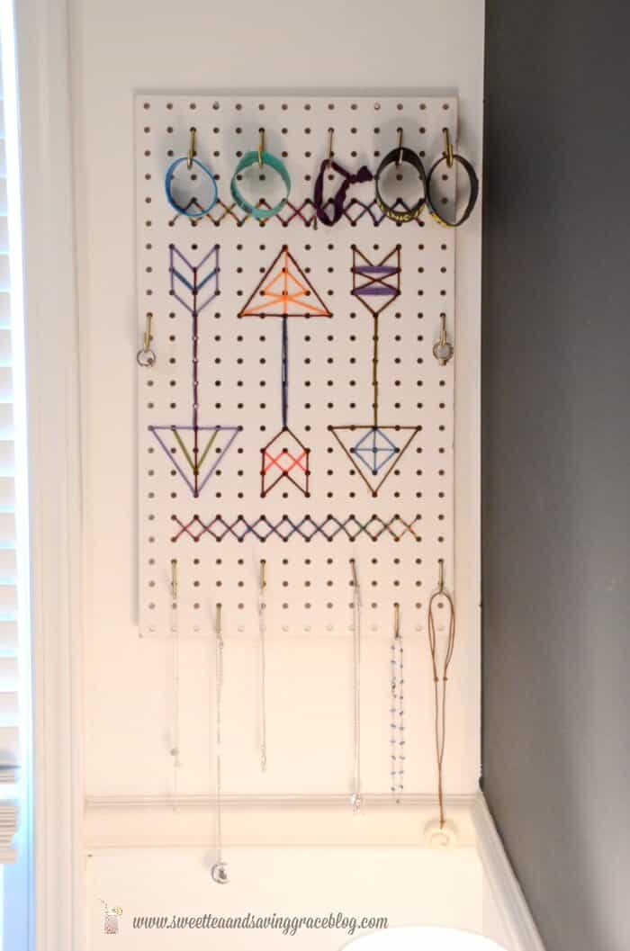 12. DIY CROSS-STITCH PEGBOARD JEWELRY HOLDER 12. DIY CROSS-STITCH PEGBOARD JEWELRY HOLDER