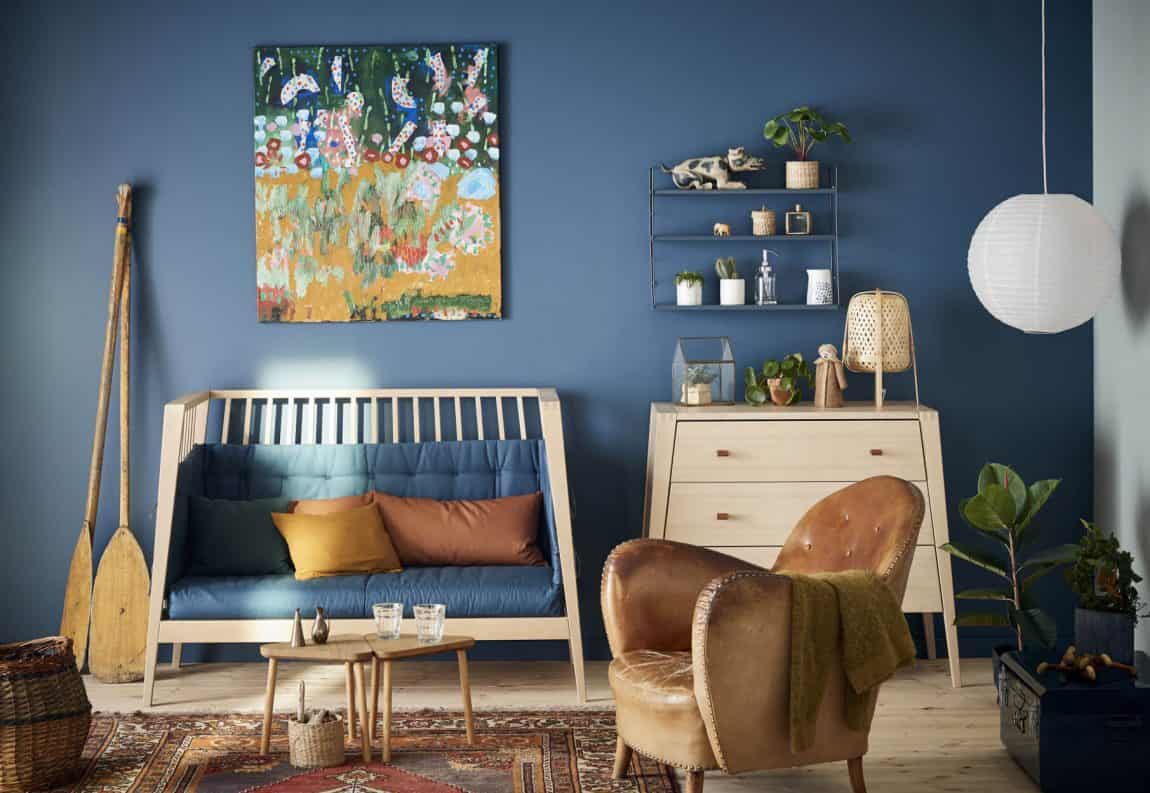 A cozy atmosphere with blue, leather, and light wood A cozy atmosphere with blue, leather, and light wood