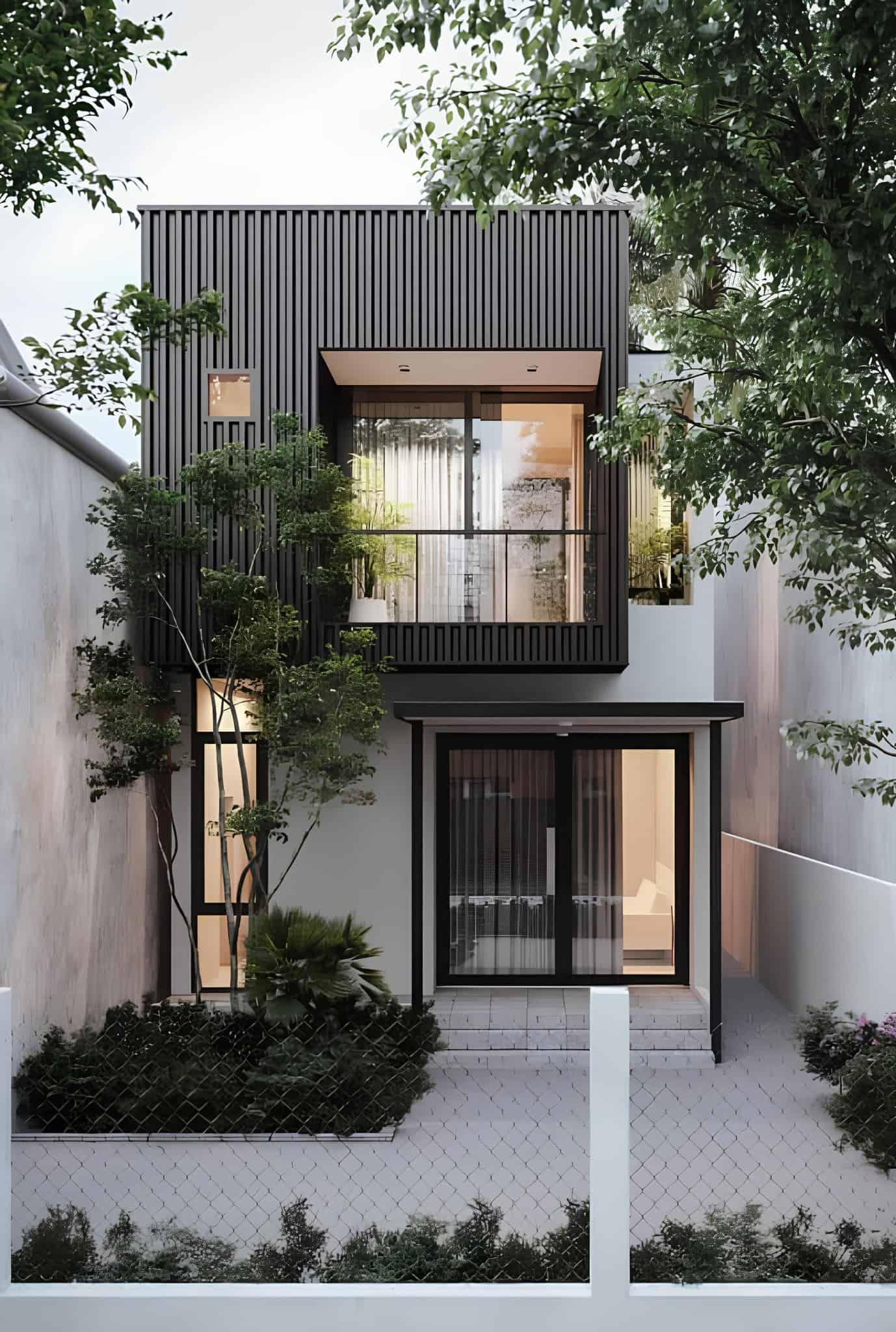 Narrow Modern Home with Black Cladding A narrow lot modern house with sleek vertical black cladding and lush garden integration.