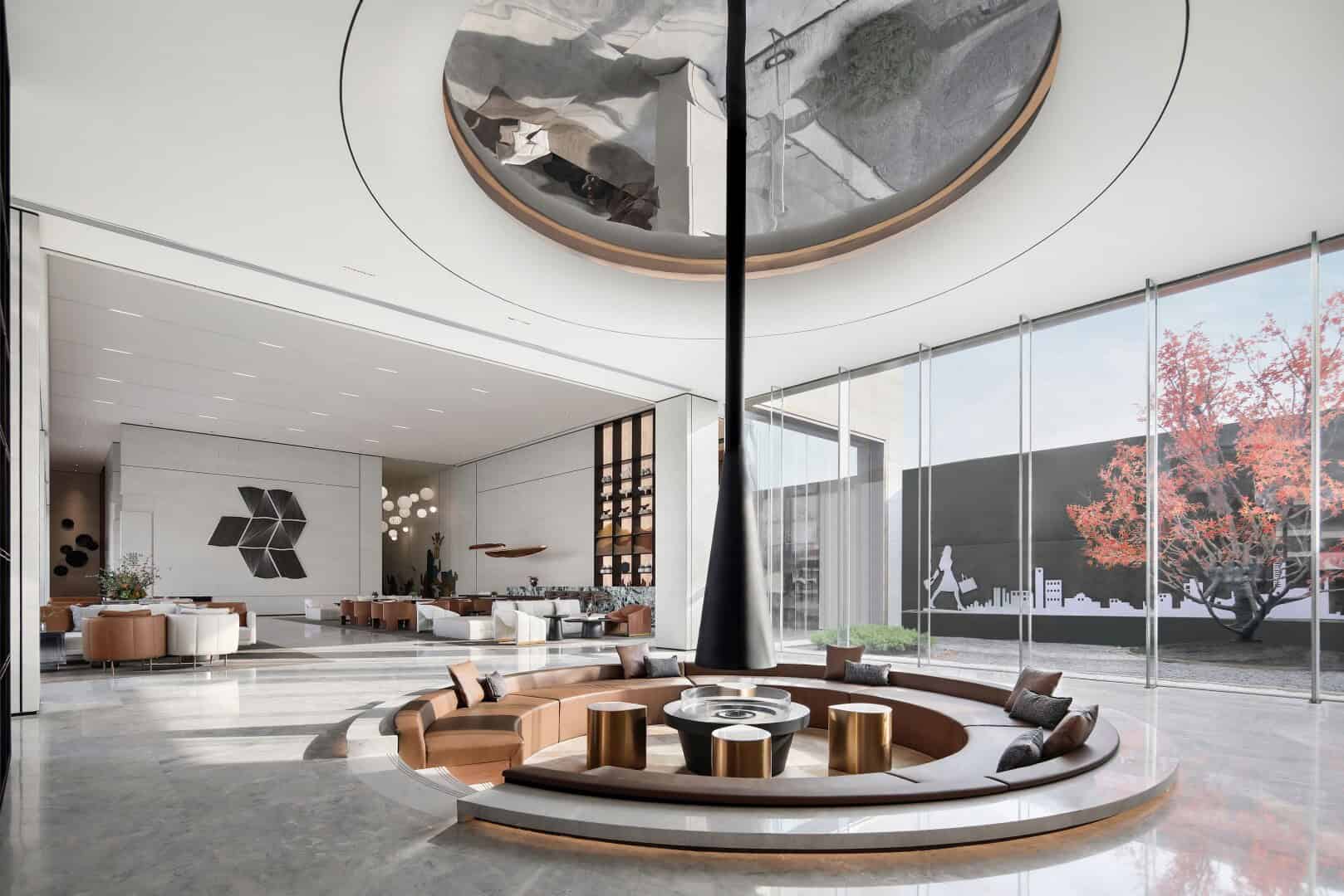 Sleek modern hotel lobby with contemporary architectural design, circular seating area, large glass windows, and artistic interior decor, showcasing luxurious interior architecture.
