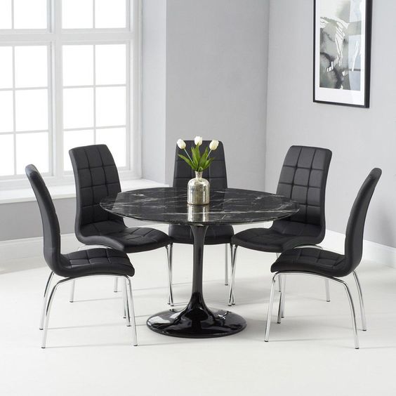 The Round Black Marble Table Is The Absolute Favorite