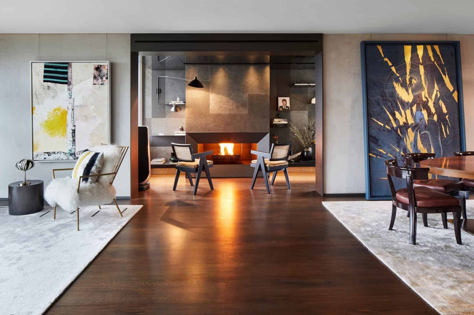 Modern living room with stylish fireplace, contemporary furniture, and abstract art, showcasing innovative interior design and luxury home decor elements.