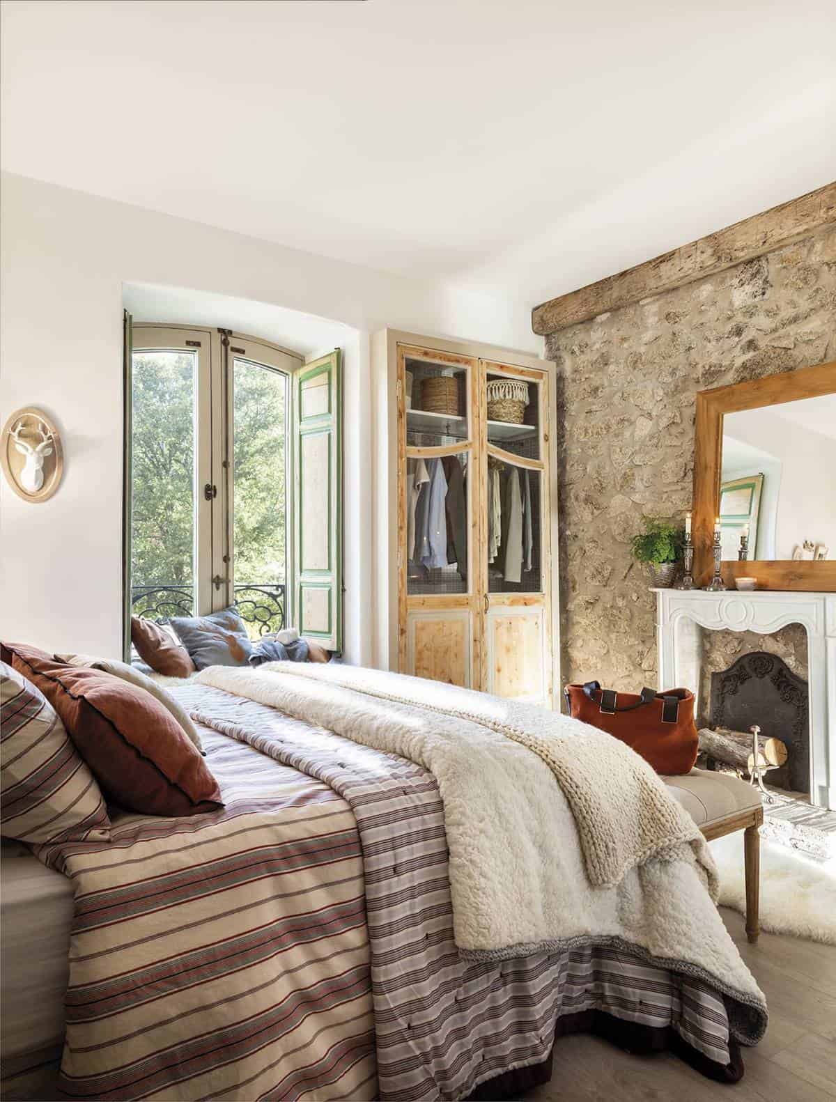 4. A cozy bedroom with a decorative fireplace 4. A cozy bedroom with a decorative fireplace