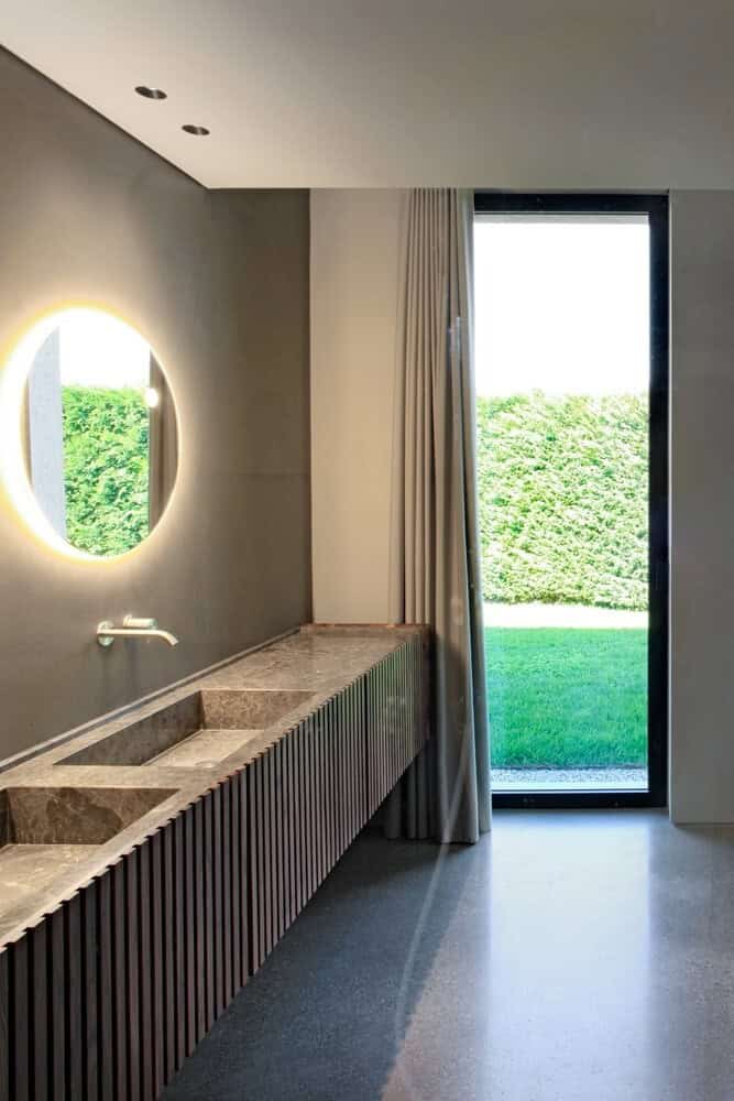 House Surrounded by Greenery by MIDE Architects in Stra, Italy