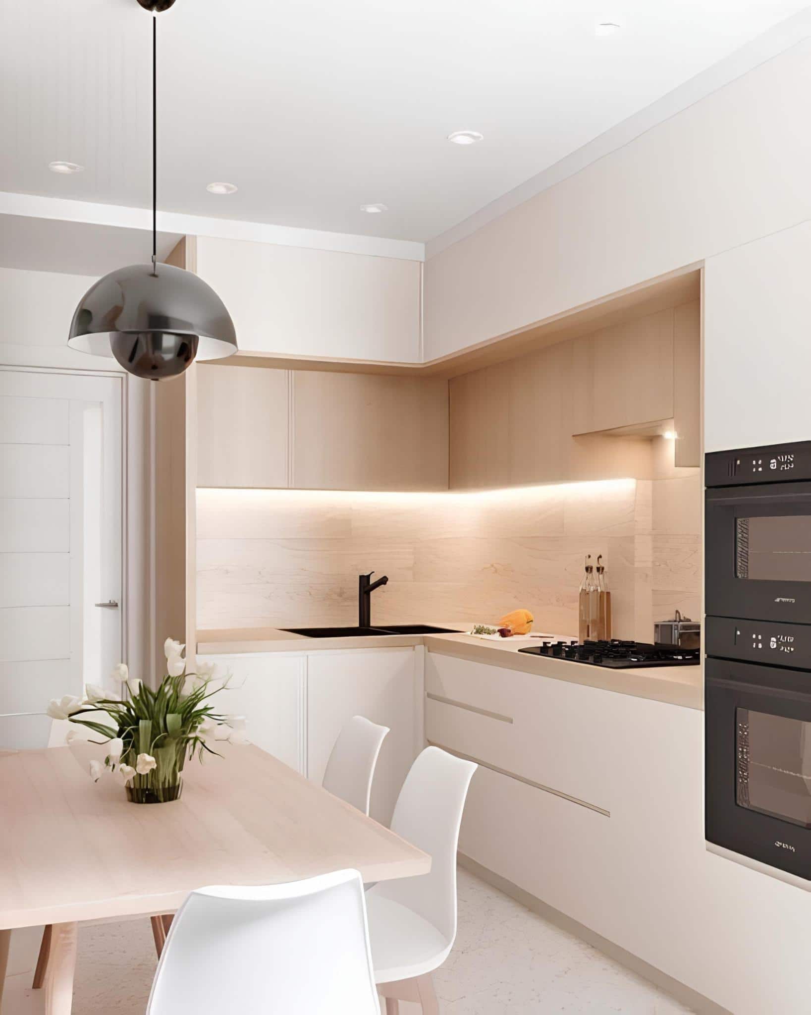 Kitchen with sloped ceiling, warm tones, and neutral decor