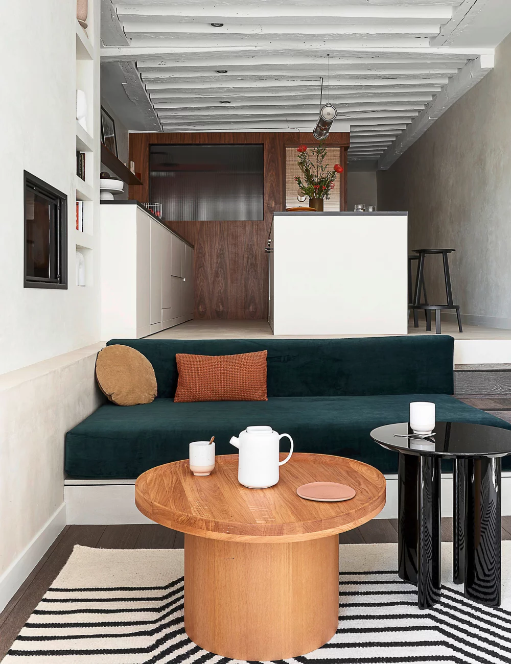 A minimalist kitchen open to the living room A minimalist kitchen open to the living room