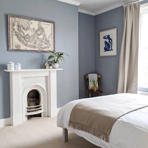A Sky Blue Bedroom With A Cozy Decor