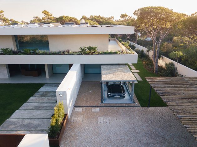 The disappearing car lift for a modern villa surrounded by nature in Portugal