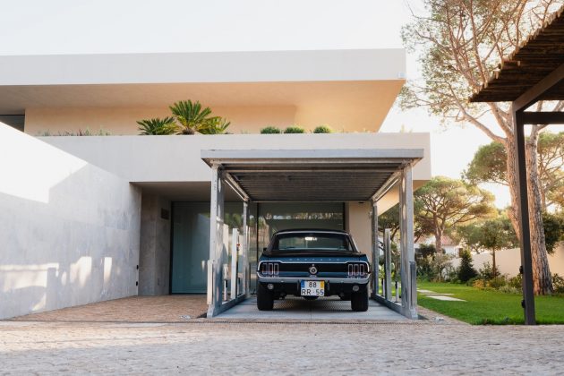 The disappearing car lift for a modern villa surrounded by nature in Portugal