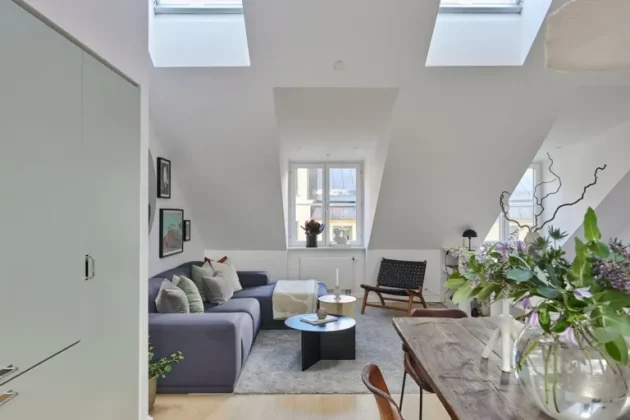 Spacious and bright Swedish penthouse with large windows opening onto the terrace
