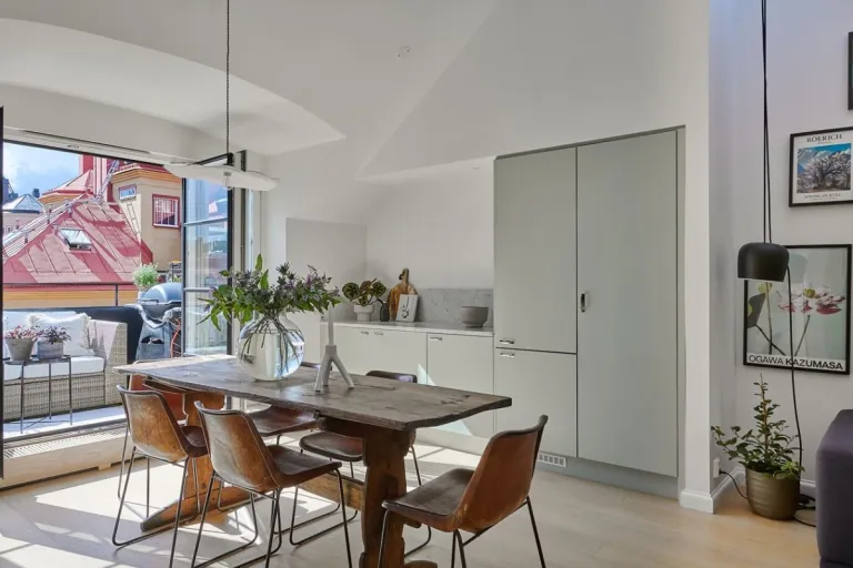 Spacious and bright Swedish penthouse with large windows opening onto the terrace