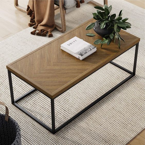 AN OVAL COFFEE TABLE FOR A FRIENDLY AND STYLISH LIVING ROOM