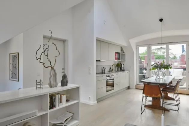Spacious and bright Swedish penthouse with large windows opening onto the terrace