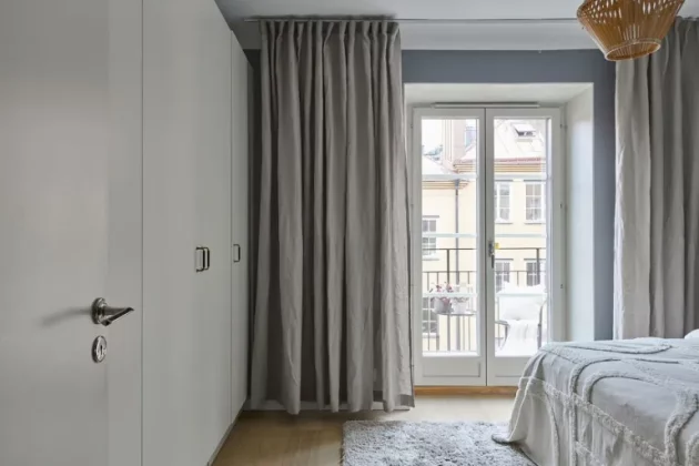 Spacious and bright Swedish penthouse with large windows opening onto the terrace