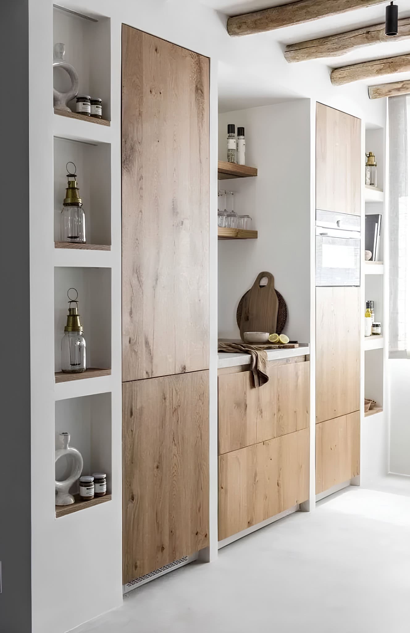 Mediterranean Style Bar Counter and Dining Nook Kitchen island with woven stools next to built-in dining bench and rustic decor.