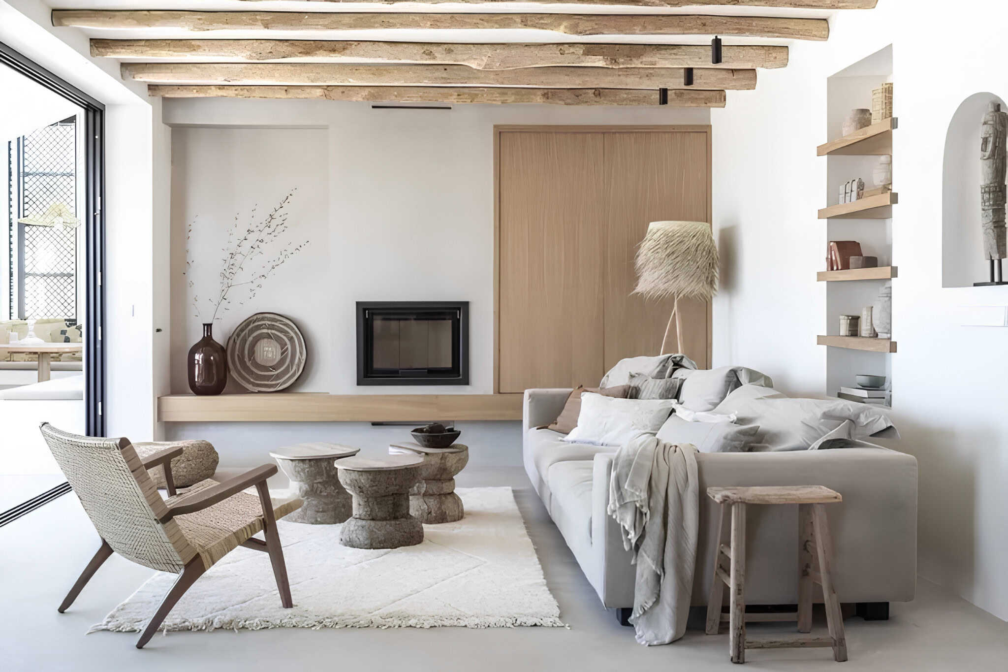 Mediterranean Style Dining Area Wicker Chairs Dining room with wooden table, wicker chairs and soft gray bench seating.